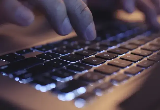 Hands-typing-on-laptop-keyboard.