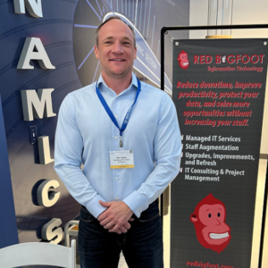Cropped image of Marc from red big foot standing at a convention